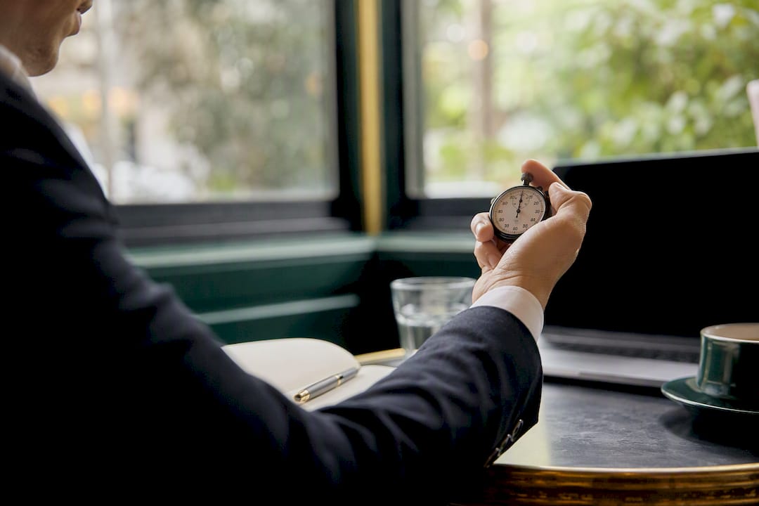 Buyers agent checking watch calmly