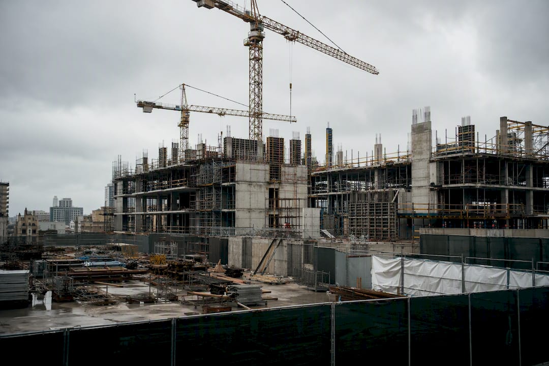Construction site paused with cranes and building